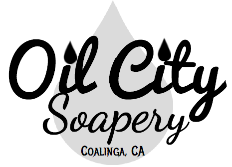 Logo of Oil City Soapery with text and paintbrushes on a white background